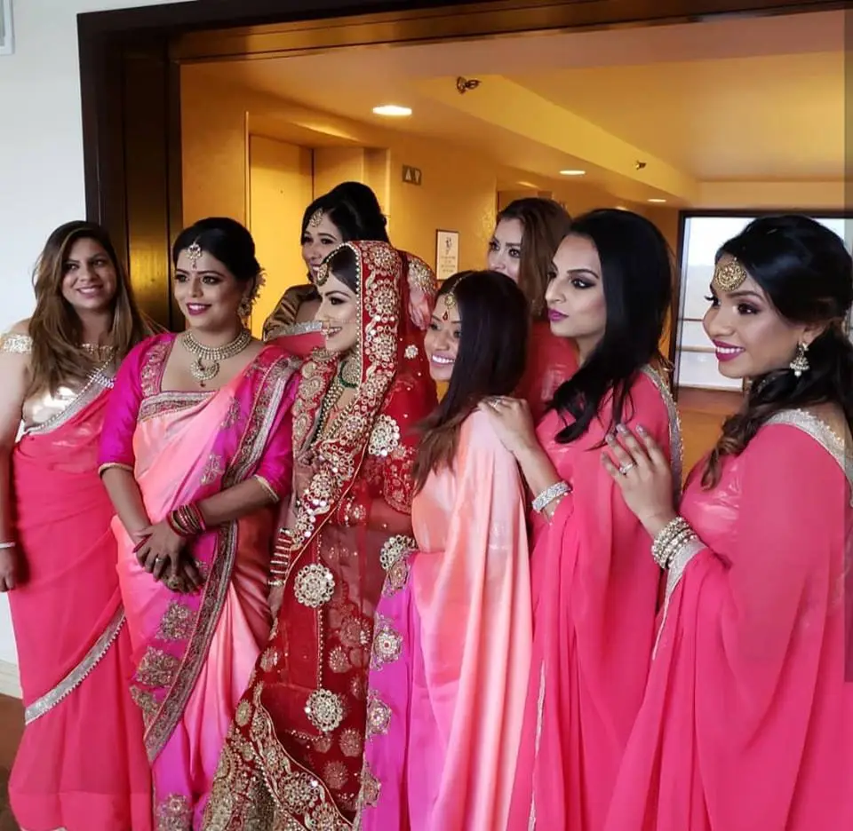 A bride with her mother, sisters and bridesmaids, all styled by Bridal Art Studio